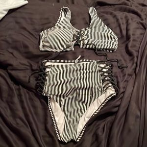 Black and white striped Bebe bathing suit size medium